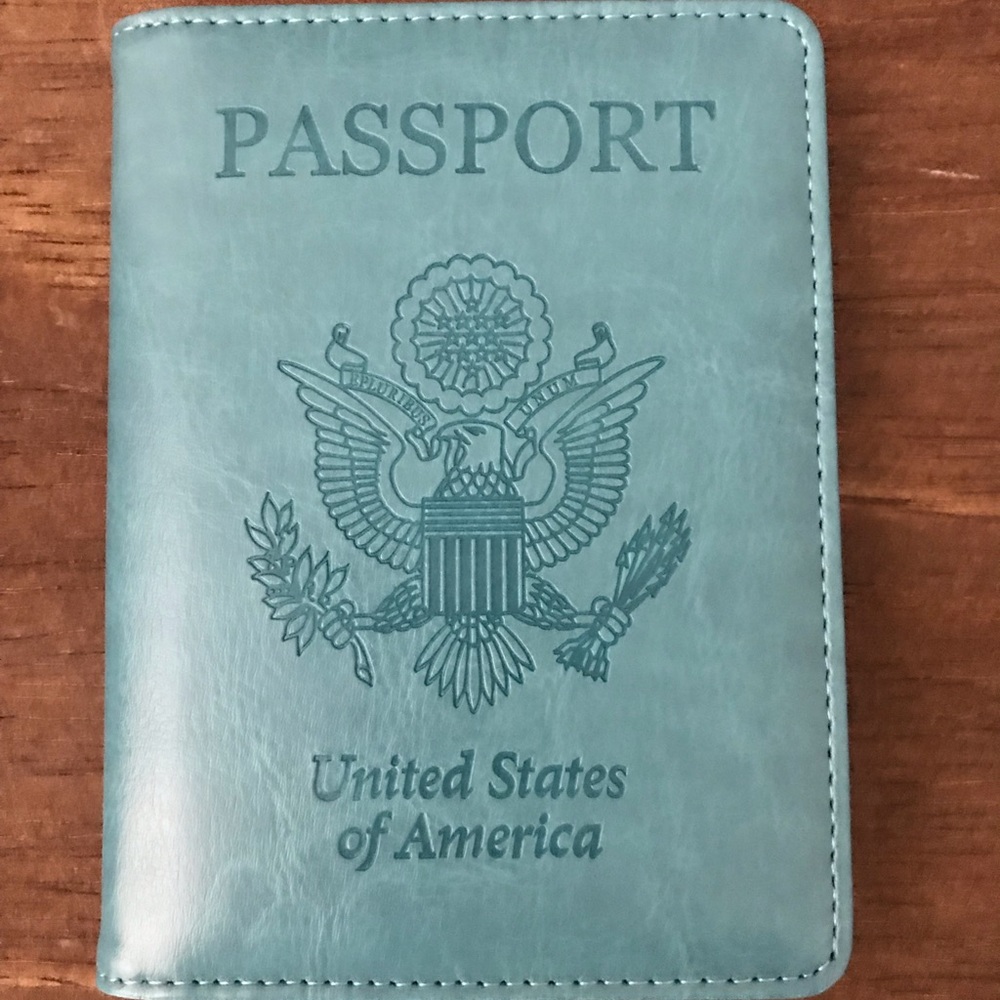 Never been used teal passport cover